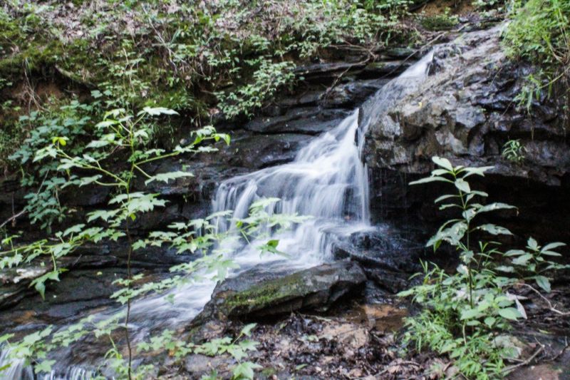 waterfall at alum hollow trail at green mountain nature preserve