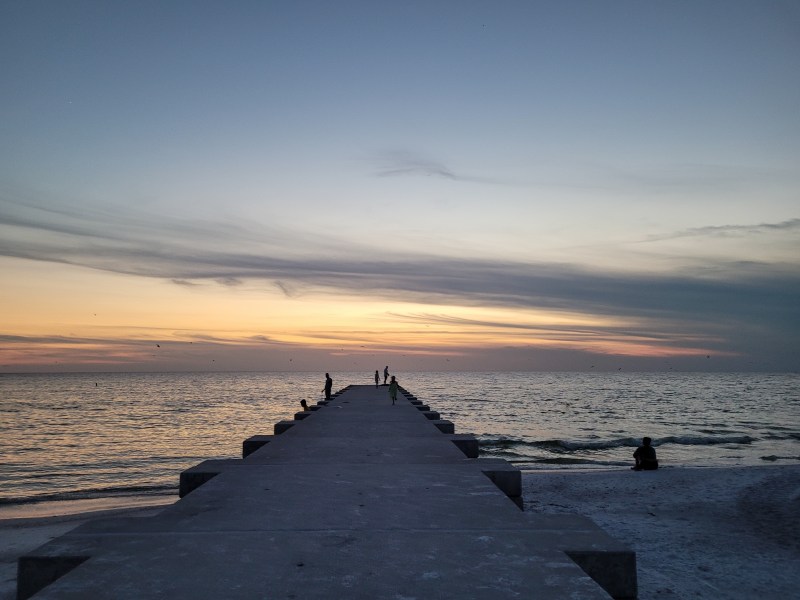 Sunset from the pier at Cortez Beach, Anna Maria Island, Florida. 