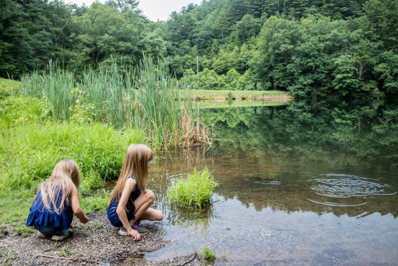 Two girls playing by the water at the campground at Vogel State Park in Blairsville, Georgia. Camping with kids. 