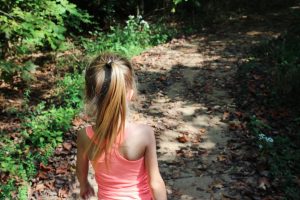 Little girl playing outside. Posted on Camping Safety Rules for Kids.