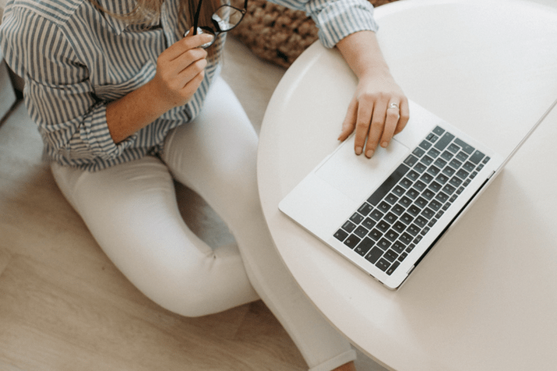 a woman on her laptop working from home as a web designer