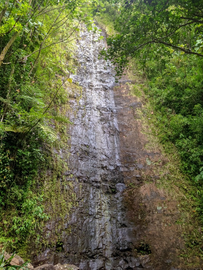 Mano Falls waterfall in Honolulu, Hawaii. Posted on a travel guide that features the best things to do with kids on Oahu, Hawaii. 