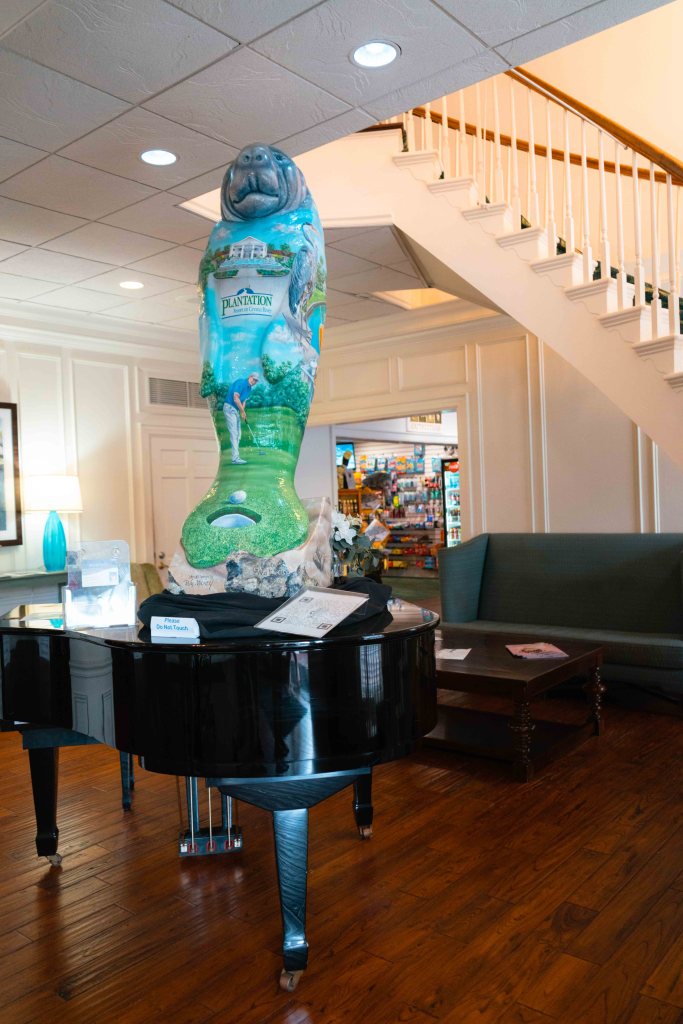 Piano and manatee at Plantation on Crystal River lobby / entrance. 