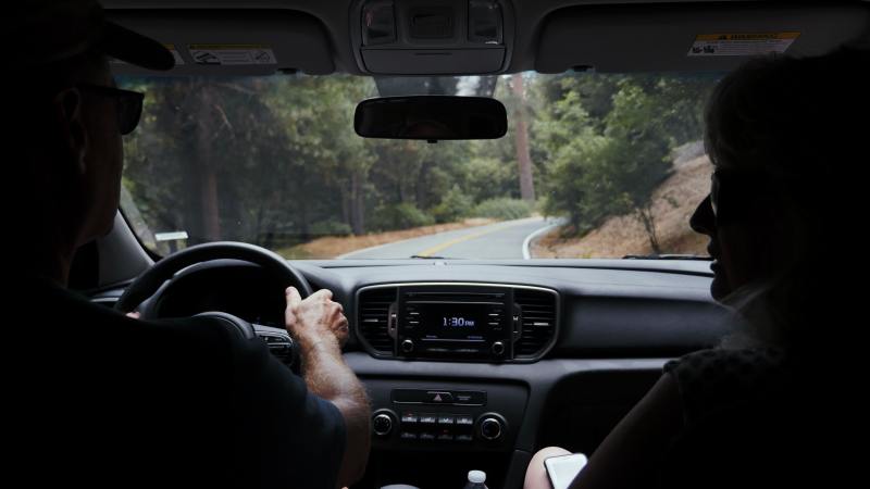 a family driving down a road during a family road trip