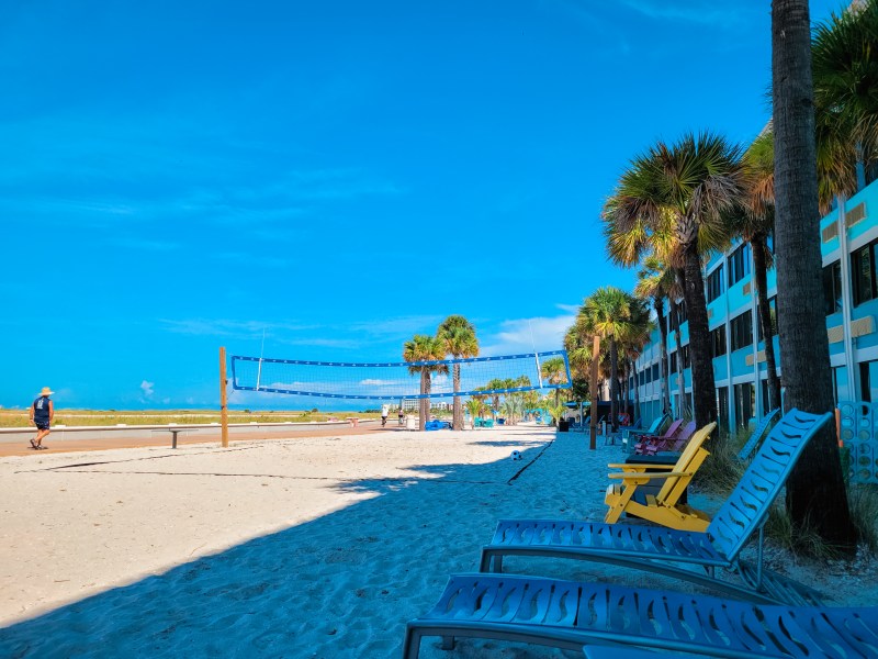 Beach chairs and a volleyball net at the Bilmar Beach Resort at Treasure Island