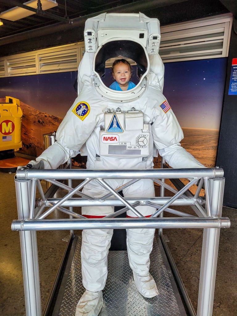 a baby at the astronaut photo op 